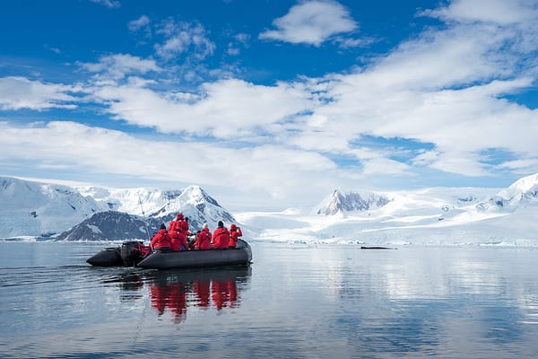 Inflatable boat full of tourists Antarctic Peninsula Antarctica